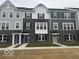 Charming townhome exterior with stone accents, offering a welcoming curb appeal at 5964 Lomita Ave, Plainfield, IN 46168