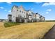 New townhomes with attractive exteriors, landscaping, and inviting front entrances at 5964 Lomita Ave, Plainfield, IN 46168
