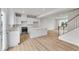 Modern kitchen with white cabinets, stainless steel appliances, and wood floors at 5964 Lomita Ave, Plainfield, IN 46168