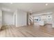 Open-concept living area with wood floors and lots of natural light at 5964 Lomita Ave, Plainfield, IN 46168