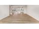 Open-concept space with wood floors, an island, and lots of natural light at 5964 Lomita Ave, Plainfield, IN 46168