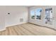 Living area featuring wood-style floors, access to a door, and a window at 5964 Lomita Ave, Plainfield, IN 46168