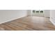 Living room featuring wood-style floors, neutral paint, and large window at 5964 Lomita Ave, Plainfield, IN 46168
