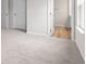 Serene main bedroom featuring neutral carpet, closet, and ensuite bath with wood-look flooring at 5964 Lomita Ave, Plainfield, IN 46168
