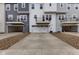 Modern townhomes featuring private garages, balconies, and contemporary design elements at 5964 Lomita Ave, Plainfield, IN 46168
