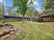 Large backyard with fire pit, screened gazebo with hot tub offering outdoor entertainment and relaxation at 6827 S 500 W, Trafalgar, IN 46181