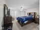 Spacious bedroom with neutral carpeting, ceiling fan, and ensuite bathroom access at 6827 S 500 W, Trafalgar, IN 46181