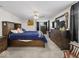 Large bedroom featuring neutral decor, a ceiling fan, dark curtains, and ample space at 6827 S 500 W, Trafalgar, IN 46181
