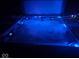 Close-up of a modern hot tub with glowing blue lights, creating a relaxing ambiance at 6827 S 500 W, Trafalgar, IN 46181