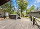 Wooden deck featuring a hot tub, perfect for relaxing and enjoying the scenic outdoors at 6827 S 500 W, Trafalgar, IN 46181
