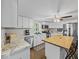 Well-lit kitchen featuring white cabinets, stainless steel appliances, and an island at 6827 S 500 W, Trafalgar, IN 46181