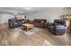 Spacious living room featuring hardwood floors, neutral walls and multiple seating options at 6827 S 500 W, Trafalgar, IN 46181