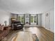 Comfortable living room with hardwood floors, natural light, and a cozy seating arrangement at 6827 S 500 W, Trafalgar, IN 46181