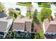 An aerial view of a home with a cozy backyard patio, manicured lawn, and privacy fence at 701 Danver Ln, Beech Grove, IN 46107