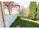 This backyard features a freshly stained privacy fence, and mature shade trees at 701 Danver Ln, Beech Grove, IN 46107