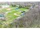 Aerial view of well-kept baseball fields surrounded by lush greenery, highlighting the community's amenities at 701 Danver Ln, Beech Grove, IN 46107