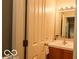 A bathroom featuring a vanity, sink, and light fixture above the mirror at 701 Danver Ln, Beech Grove, IN 46107