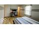 Bedroom with modern bed frame, desk, and chair by the window at 701 Danver Ln, Beech Grove, IN 46107