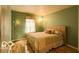 Bedroom featuring green walls and a window at 701 Danver Ln, Beech Grove, IN 46107