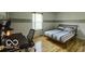 Bedroom with modern bed frame, desk, and chair by the window at 701 Danver Ln, Beech Grove, IN 46107