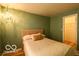 Bedroom featuring green walls and a closet at 701 Danver Ln, Beech Grove, IN 46107
