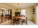 Bright dining area with a wooden table and a window, perfect for Gathering meals at 701 Danver Ln, Beech Grove, IN 46107
