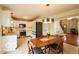 Inviting dining room featuring wood table, rug, and modern light fixture at 701 Danver Ln, Beech Grove, IN 46107