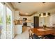 Inviting dining room featuring wood table, rug, and modern light fixture at 701 Danver Ln, Beech Grove, IN 46107