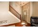 Home entryway with wooden staircase at 701 Danver Ln, Beech Grove, IN 46107