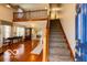 Inviting entryway featuring stairs, natural light, and a glimpse of the open-concept living space at 701 Danver Ln, Beech Grove, IN 46107