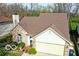 Charming home with a manicured lawn, brick accents, and a two-car garage in a Gathering-friendly neighborhood at 701 Danver Ln, Beech Grove, IN 46107