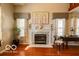 Cozy fireplace area with decorative mantle and hearth, complemented by natural light from nearby windows at 701 Danver Ln, Beech Grove, IN 46107