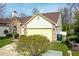 Charming home featuring a well-maintained lawn and a two-car garage, adding to its appeal at 701 Danver Ln, Beech Grove, IN 46107
