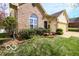 Attractive home with a beautifully landscaped front yard and a two-car garage at 701 Danver Ln, Beech Grove, IN 46107