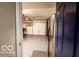 Spacious garage featuring epoxy flooring, overhead lighting, and ample room for storage or projects at 701 Danver Ln, Beech Grove, IN 46107