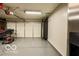 Clean garage with a large roll up door, offering storage space and room for your vehicles at 701 Danver Ln, Beech Grove, IN 46107