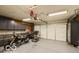 Well-organized garage with ample storage cabinets and an epoxy floor, ideal for DIY projects and hobbies at 701 Danver Ln, Beech Grove, IN 46107