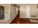 Hallway showcasing hardwood floors and access to various rooms in the home at 701 Danver Ln, Beech Grove, IN 46107