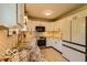 Modern kitchen featuring white cabinets and stainless steel appliances at 701 Danver Ln, Beech Grove, IN 46107