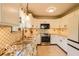 Modern kitchen featuring white cabinets and stainless steel appliances at 701 Danver Ln, Beech Grove, IN 46107