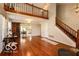 Open-concept living space with hardwood floors, a loft area, and ample natural light, creating a spacious feel at 701 Danver Ln, Beech Grove, IN 46107