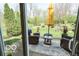 Relaxing patio with wicker furniture and a garden view at 701 Danver Ln, Beech Grove, IN 46107