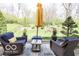 Relaxing patio with wicker furniture and a garden view at 701 Danver Ln, Beech Grove, IN 46107