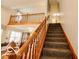 Carpeted staircase with wooden railings at 701 Danver Ln, Beech Grove, IN 46107