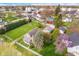 Charming home with lush landscaping, inviting front porch, and detached garage in a quiet neighborhood at 702 S Fanning St, Sheridan, IN 46069