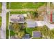 Bird's eye view of a home with a detached garage, showcasing the backyard and landscaping at 702 S Fanning St, Sheridan, IN 46069