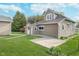Backyard featuring a well-maintained lawn, a patio, and a detached garage at 702 S Fanning St, Sheridan, IN 46069