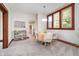 Charming dining room features neutral tones, wood trim, a table for four, and ample natural light at 702 S Fanning St, Sheridan, IN 46069