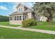 Attractive home exterior featuring a well-kept lawn, established trees, and sidewalk at 702 S Fanning St, Sheridan, IN 46069