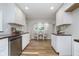 Efficient kitchen space features white cabinets, wood countertops, stainless steel appliances and an adjacent dining area at 702 S Fanning St, Sheridan, IN 46069